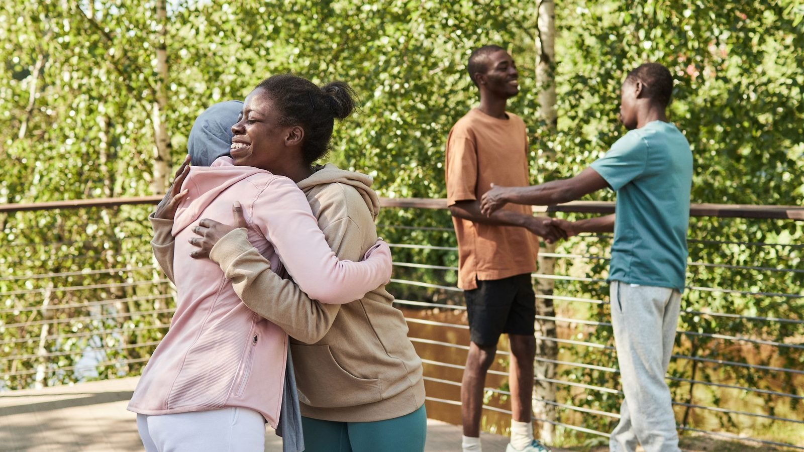 A group of friends laughing together outdoors.